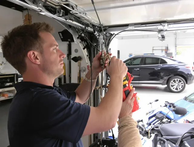 Rincon Garage Door Repair safety certified technician performing cable replacement in Rincon