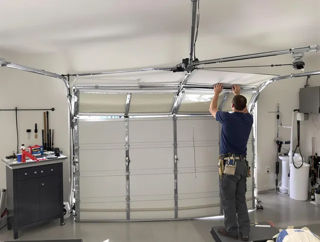 Rincon Garage Door Repair specialist performing precise section replacement on Rincon garage door
